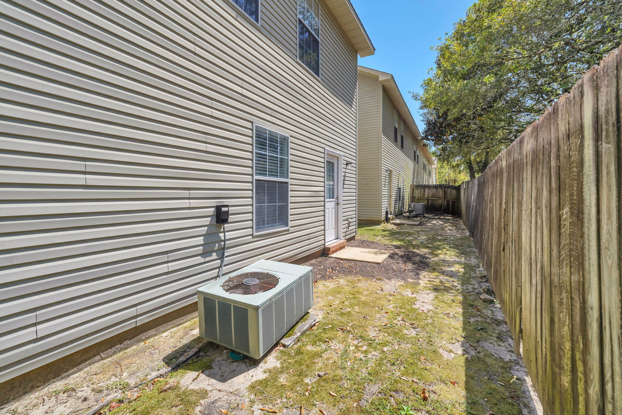 1036 Blue Ridge Drive Fort Walton Beach, FL 32547 - Photo 30 of 31 a backyard of a house with table and chairs
