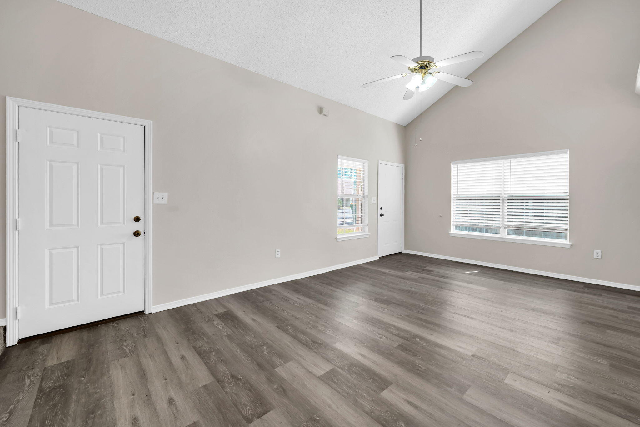 1036 Blue Ridge Drive Fort Walton Beach, FL 32547 - Photo 9 of 31 wooden floor in an empty room with a window