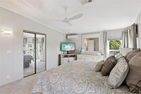 a bedroom with furniture and a window