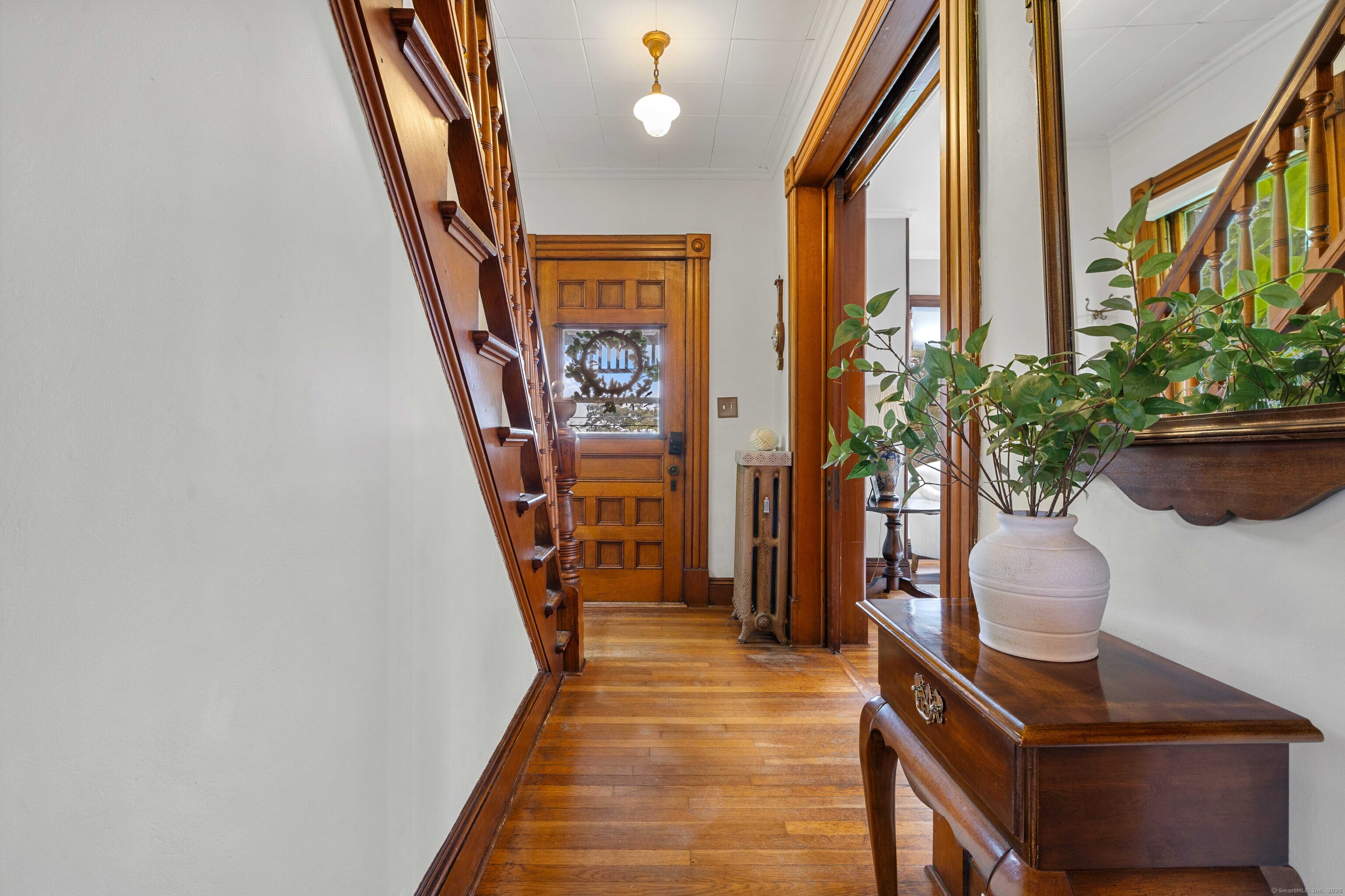 16 Prospect Hill Road Groton, CT 06340 - Photo 19 of 38 a potted plant sitting in front of a house