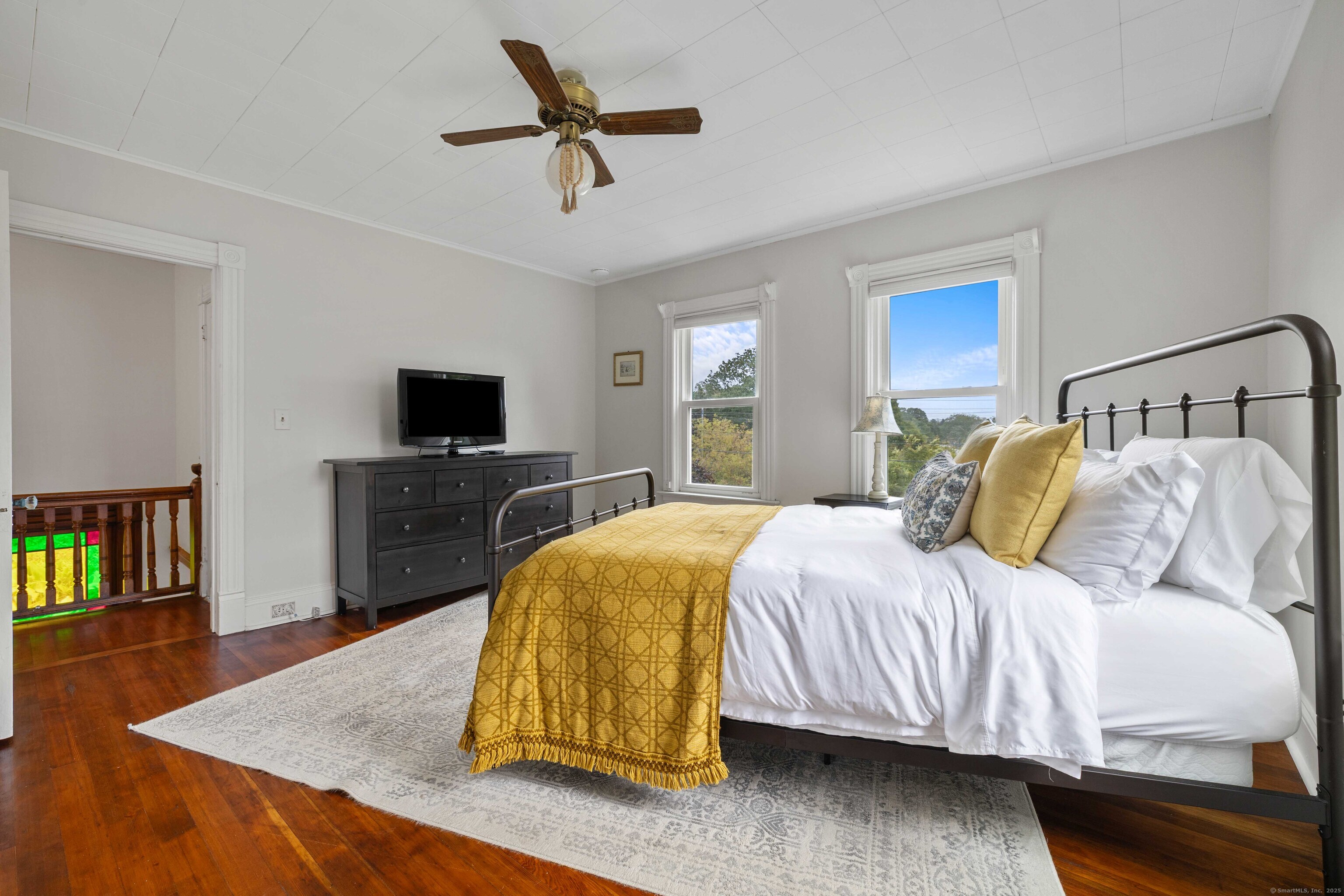 16 Prospect Hill Road Groton, CT 06340 - Photo 21 of 38 a spacious bedroom with a bed and a flat screen tv