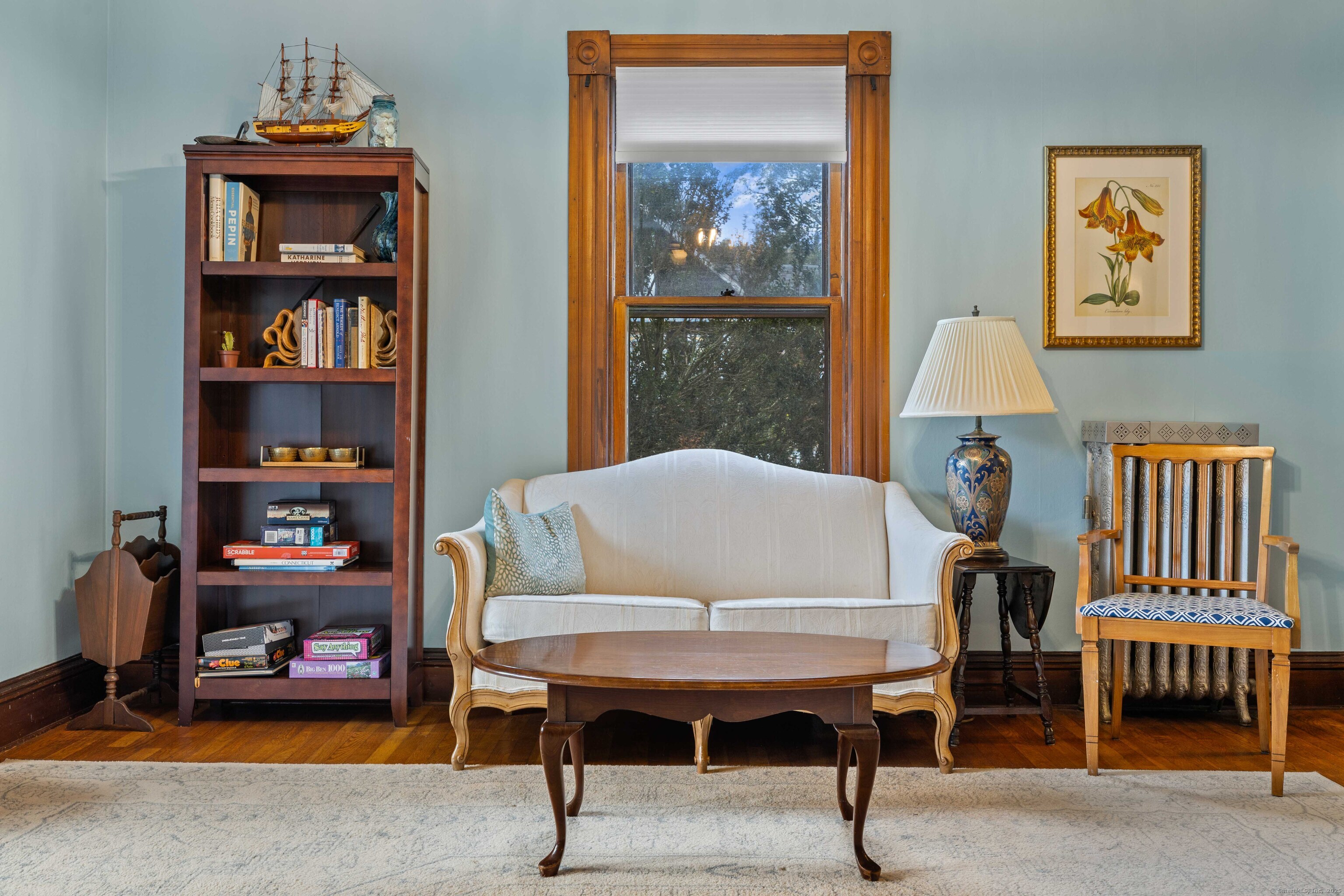 16 Prospect Hill Road Groton, CT 06340 - Photo 5 of 38 a living room with furniture and a bookshelf
