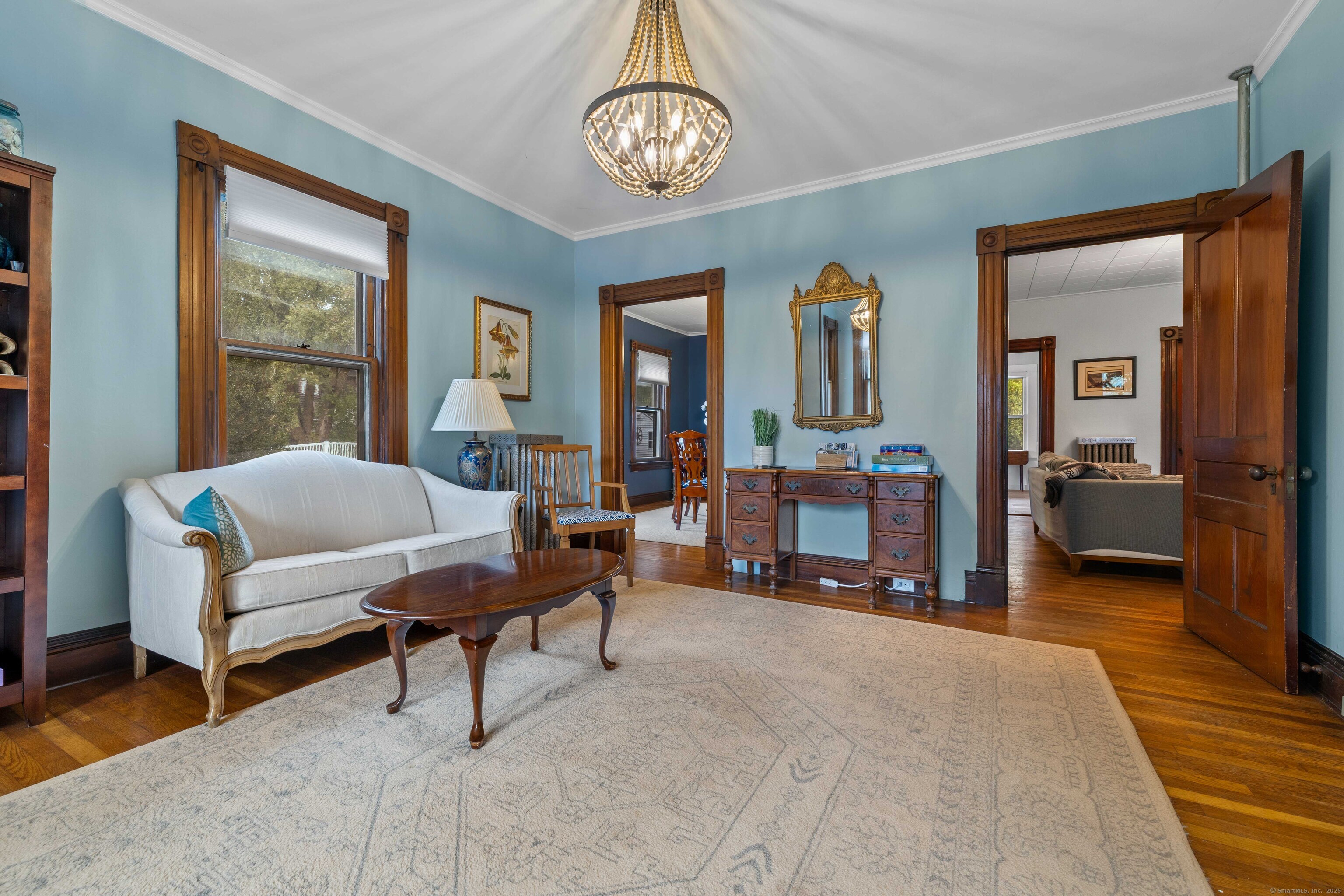 16 Prospect Hill Road Groton, CT 06340 - Photo 6 of 38 a living room with furniture and a chandelier