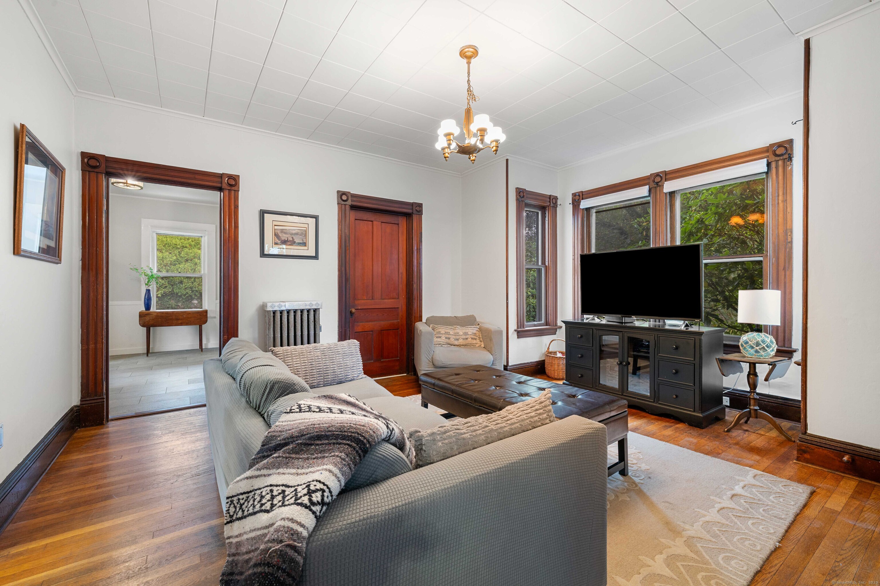 16 Prospect Hill Road Groton, CT 06340 - Photo 7 of 38 a living room with furniture and a flat screen tv