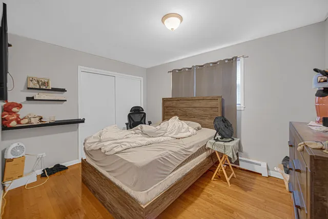 a bed room with a bed and a tv