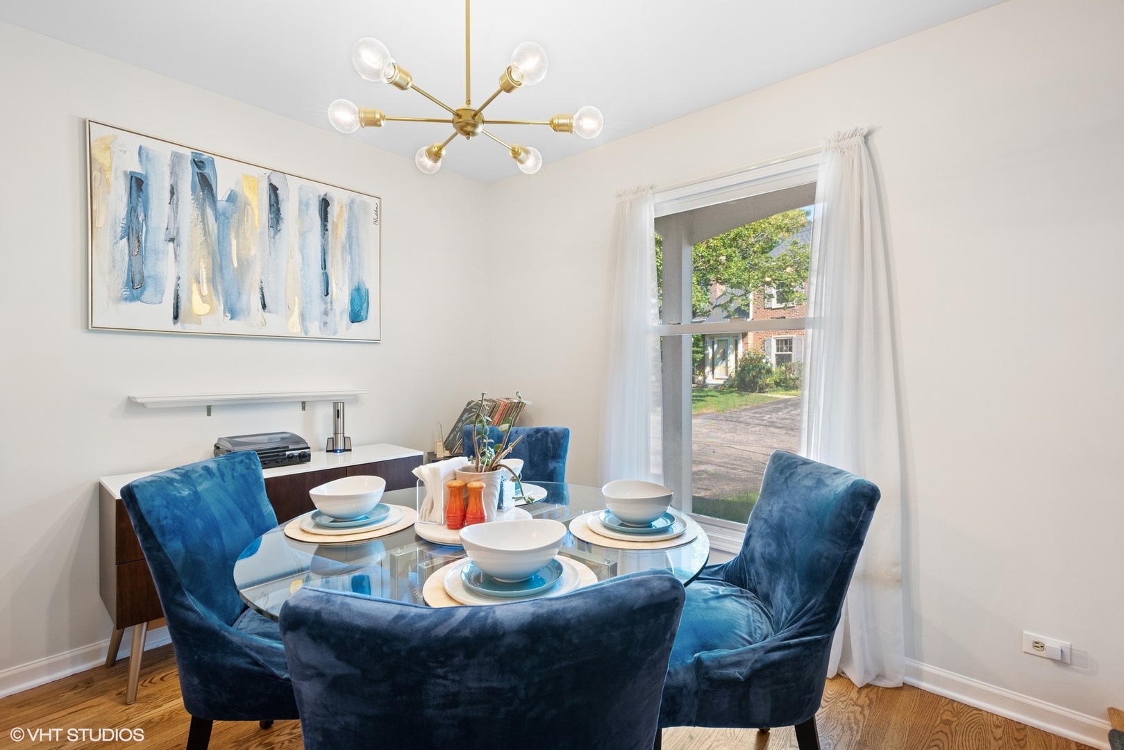 163 Bright Ridge Drive Schaumburg, IL 60194 - Photo 5 of 15 a dining room with furniture a window and a chandelier