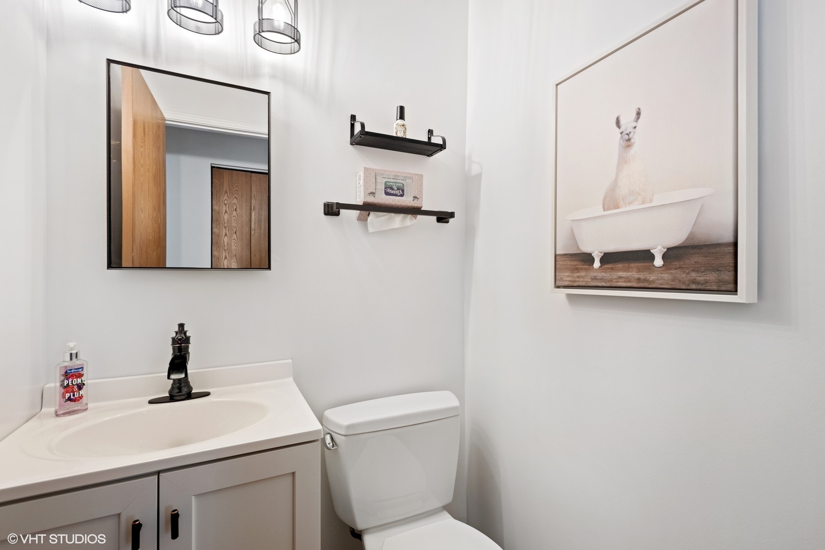 163 Bright Ridge Drive Schaumburg, IL 60194 - Photo 8 of 15 a bathroom with a toilet sink and mirror