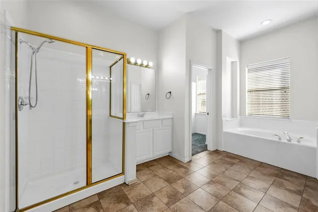 a spacious bathroom with a sink and a mirror