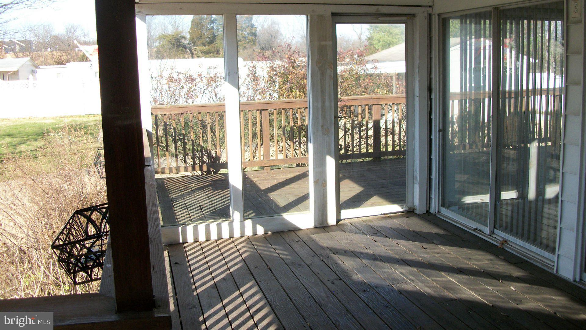 1404 Devils Reach Road Woodbridge, VA 22192 - Photo 25 of 55 Side Porch with Glass to Exterior Deck