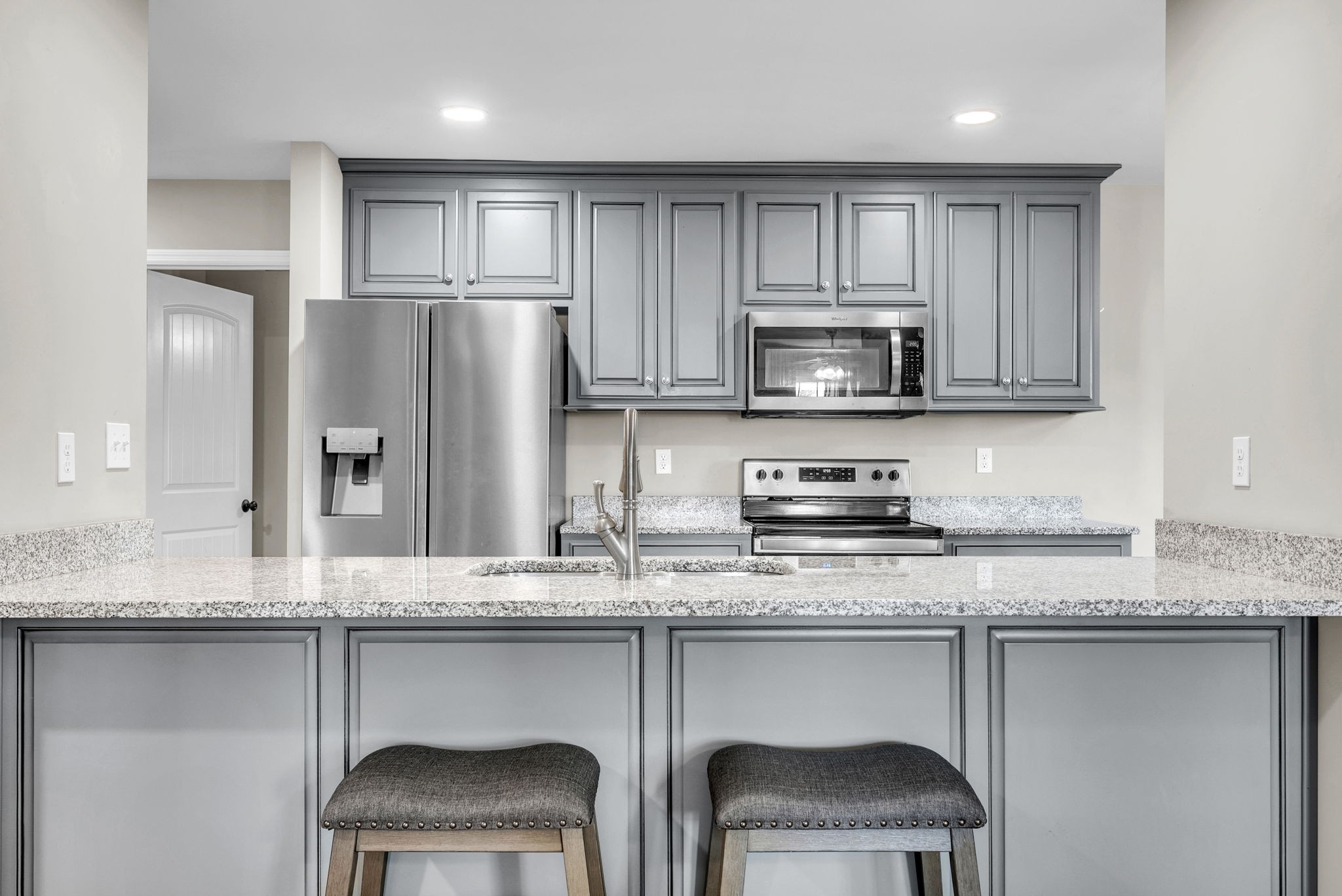 156 Old Post Road McMinnville, TN 37110 - Photo 13 of 33 a kitchen with stainless steel appliances granite countertop a stove a sink and a microwave