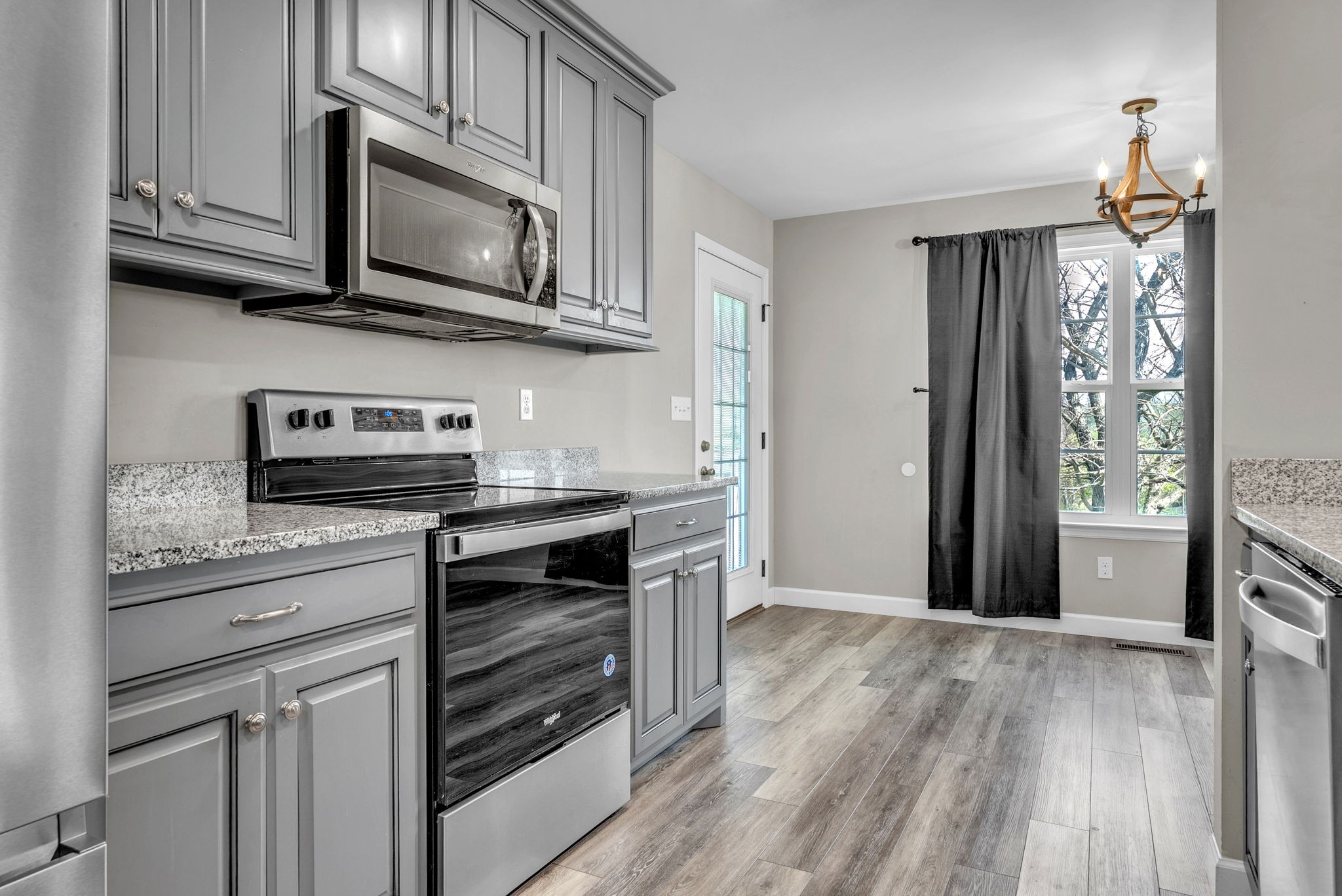 156 Old Post Road McMinnville, TN 37110 - Photo 16 of 33 a kitchen with stainless steel appliances granite countertop a stove microwave and refrigerator