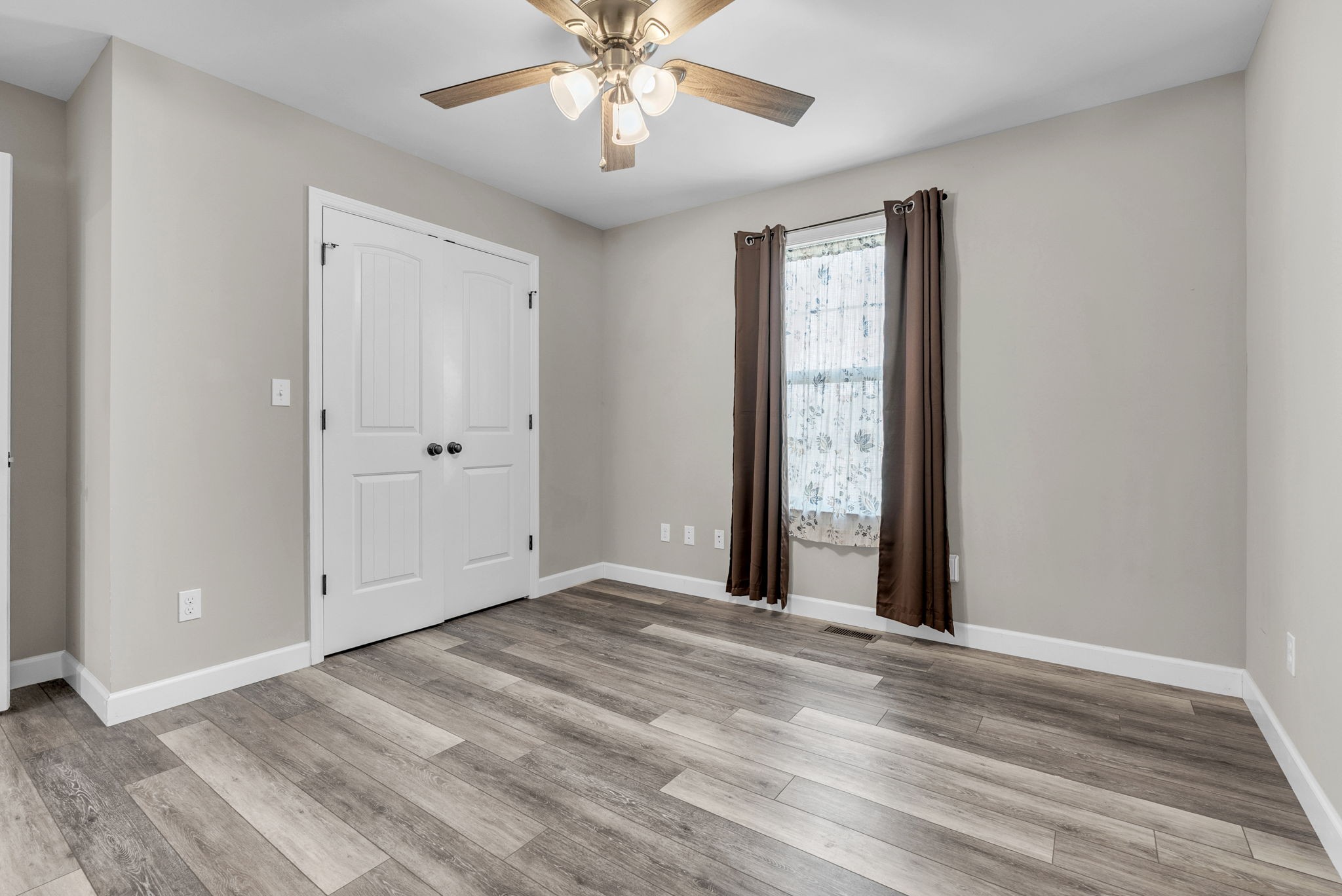 156 Old Post Road McMinnville, TN 37110 - Photo 25 of 33 a view of an empty room with wooden floor and a window