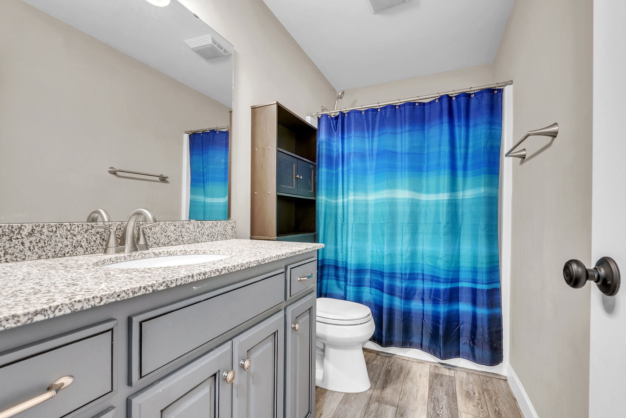 156 Old Post Road McMinnville, TN 37110 - Photo 28 of 33 a bathroom with a granite countertop sink a toilet and shower