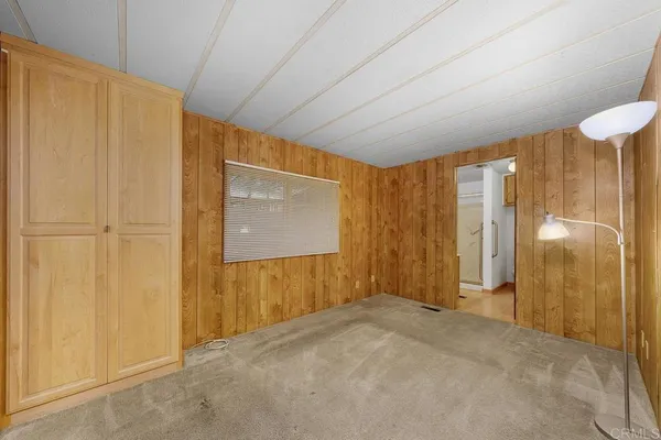 a view of entryway with wooden walls