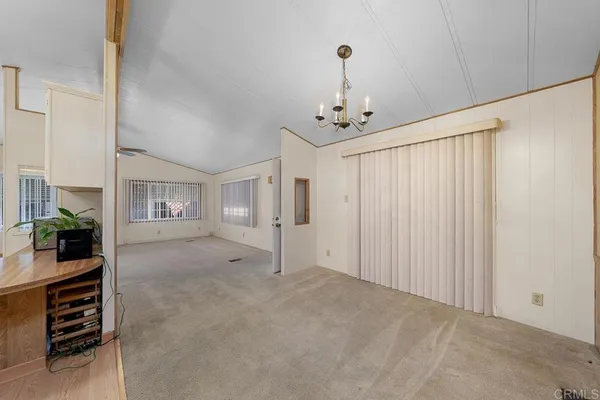 a view of a livingroom with furniture and chandelier