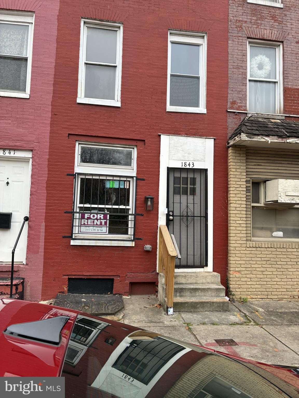 1843 West Pratt Street Baltimore, MD 21223 - Photo 1 of 1 a front view of a house with a small yard