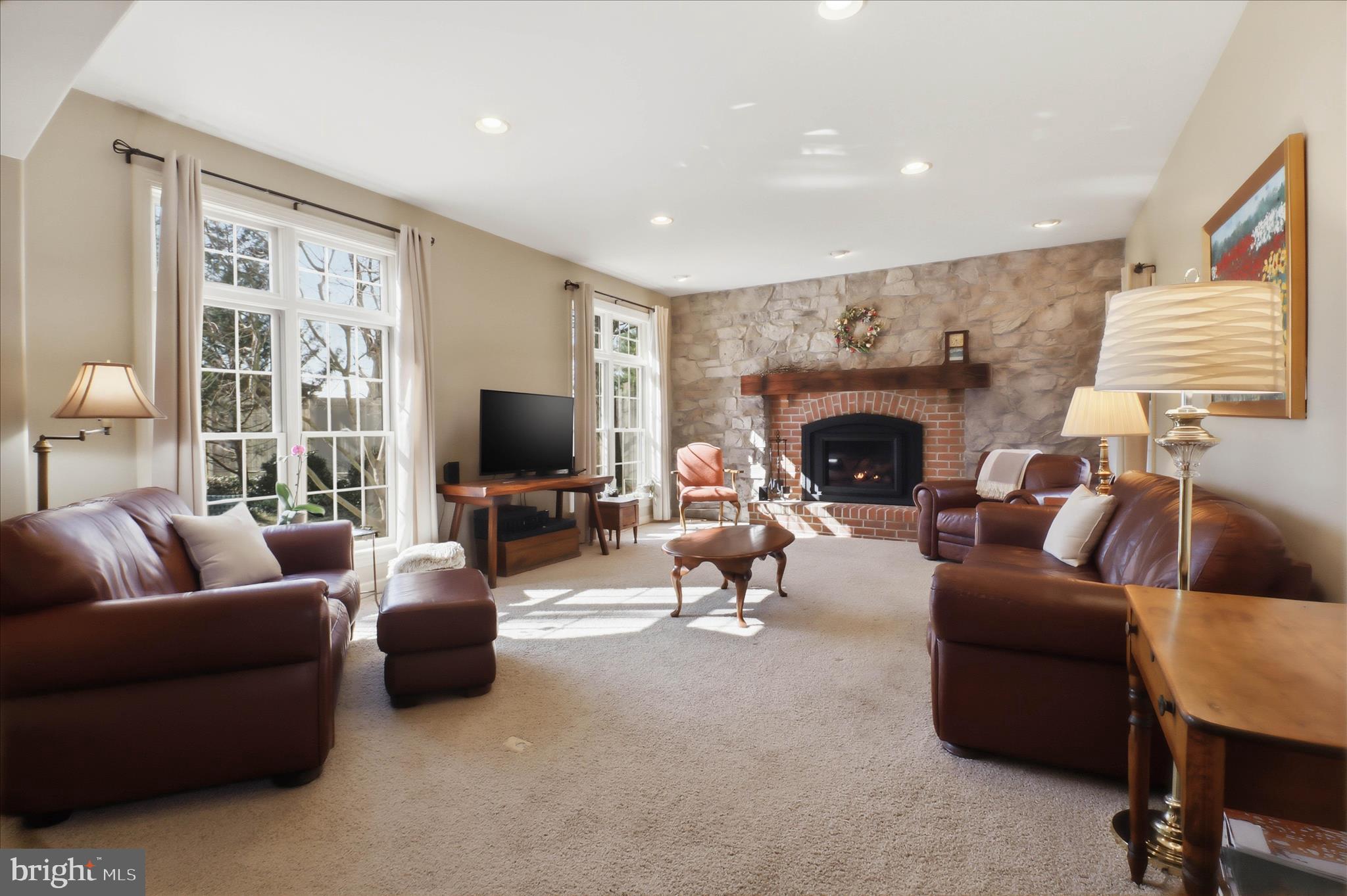 364 Evans Road Lititz, PA 17543 - Photo 15 of 58 a living room with furniture a fireplace and a flat screen tv