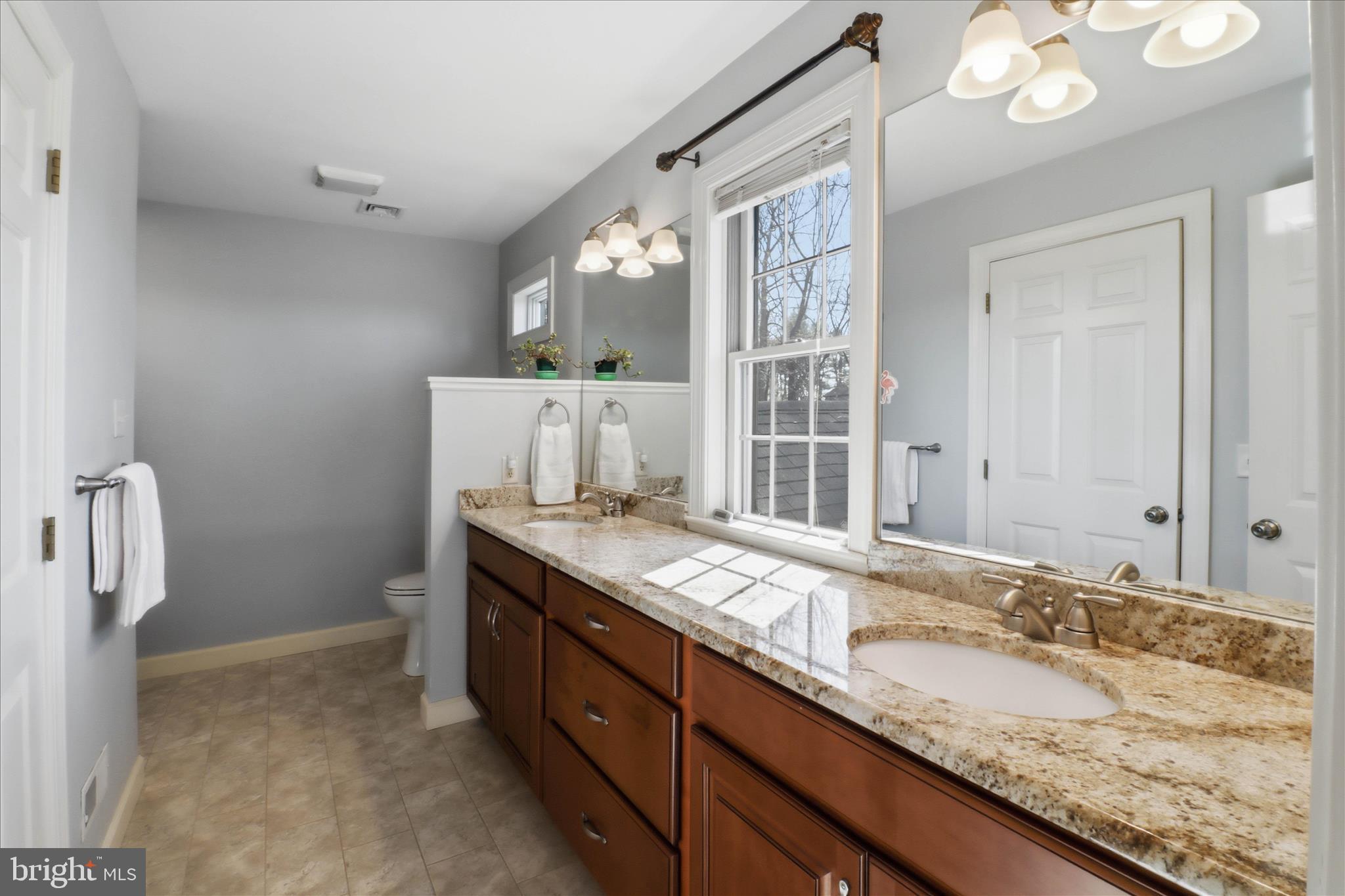 364 Evans Road Lititz, PA 17543 - Photo 30 of 58 a bathroom with a granite countertop sink and a mirror