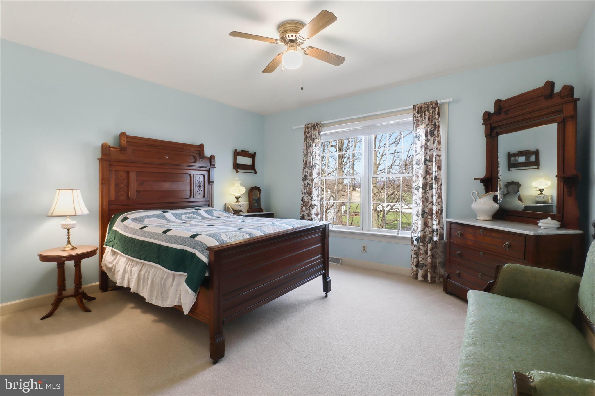 364 Evans Road Lititz, PA 17543 - Photo 35 of 58 a bedroom with a large bed and a chandelier fan