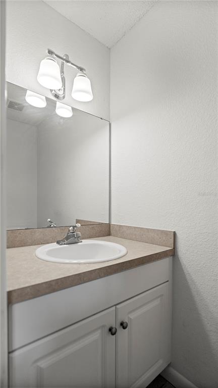 501 Southwest 75th Street, Unit B5 Gainesville, FL 32607 - Photo 29 of 38 a bathroom with a sink and a mirror