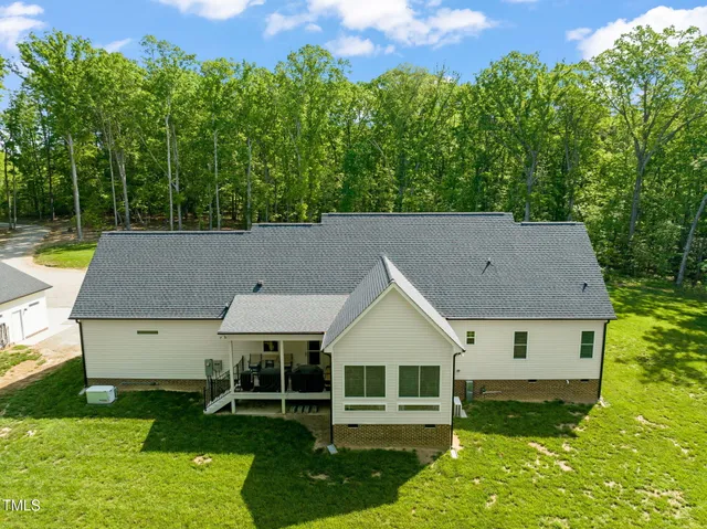 aerial view of a house with a yard