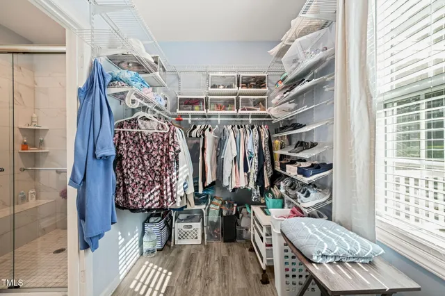 a view of entryway with furniture and wooden floor