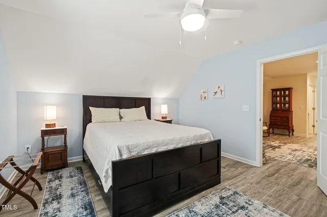 a bedroom with a bed and a mirror