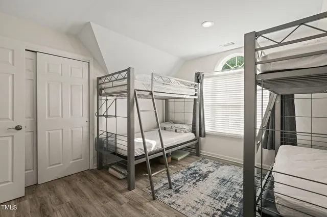 a room that has a bed and a chair in it