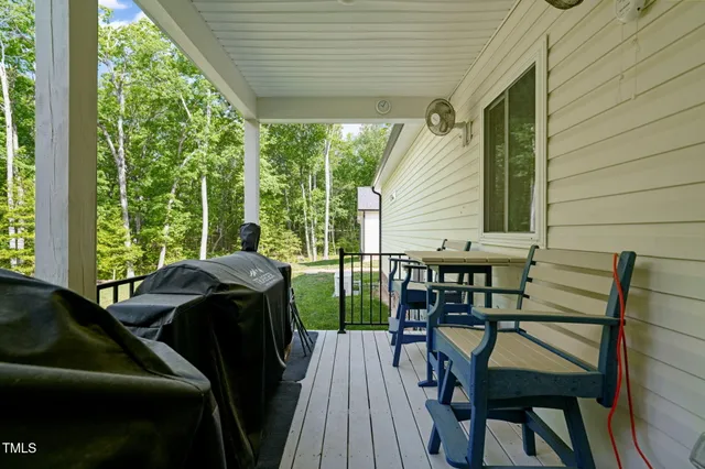 a balcony view with a seating space
