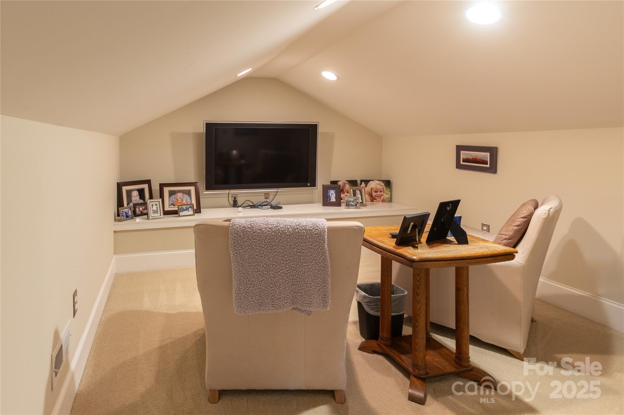 802 East Franklin Street Monroe, NC 28112 - Photo 12 of 48 a living room with furniture and a flat screen tv