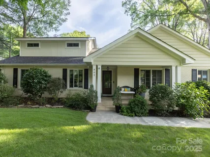 a front view of a house with a yard and porch