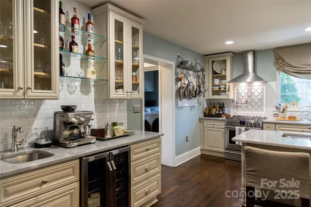 a kitchen with a sink cabinets and window