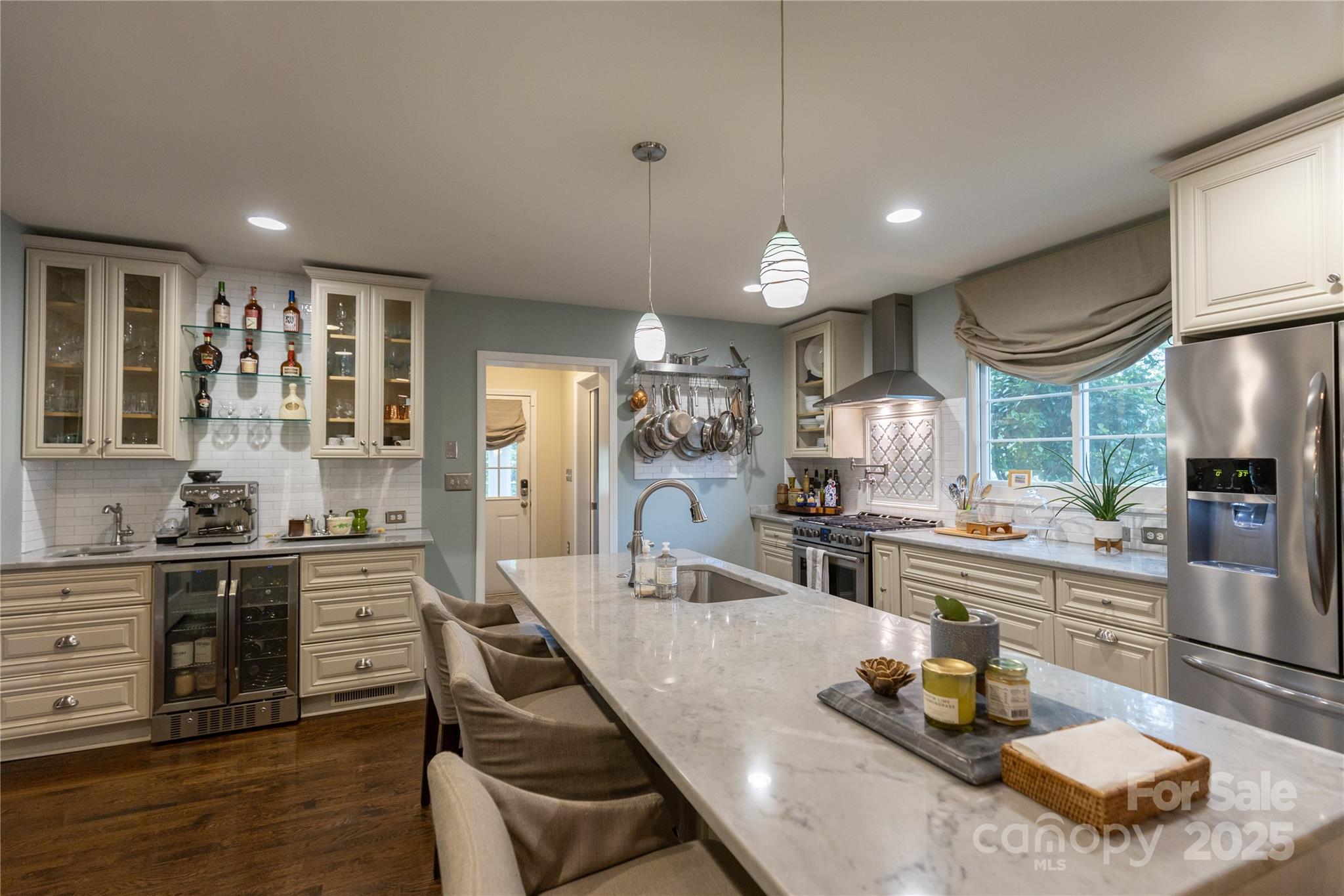 802 East Franklin Street Monroe, NC 28112 - Photo 20 of 48 a kitchen with a stove a refrigerator and wooden cabinets