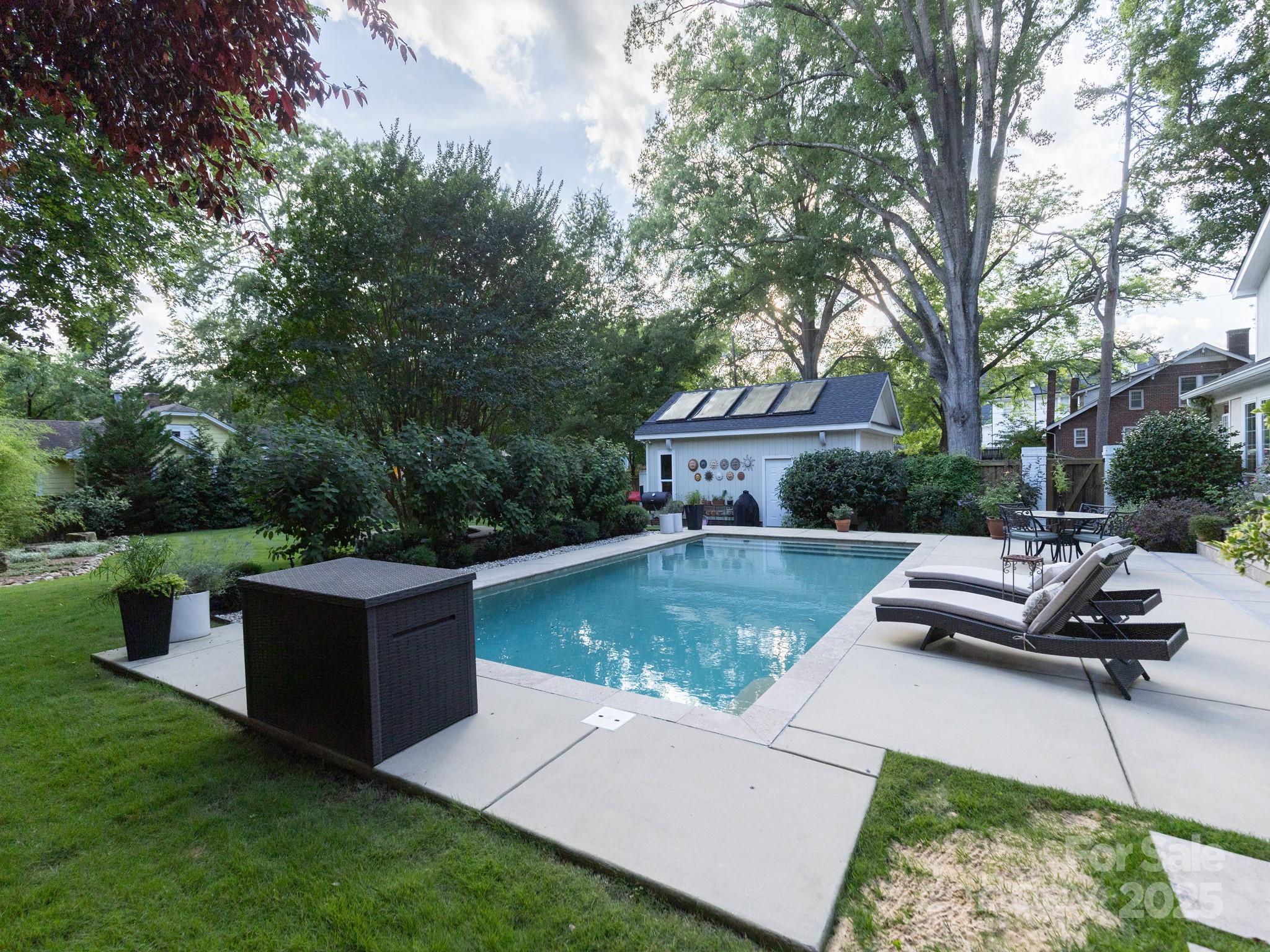 802 East Franklin Street Monroe, NC 28112 - Photo 2 of 48 a view of a house with pool and sitting area