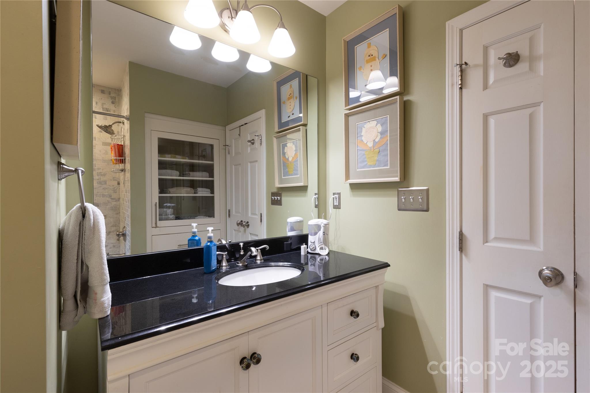 802 East Franklin Street Monroe, NC 28112 - Photo 29 of 48 a bathroom with a double vanity sink and a mirror