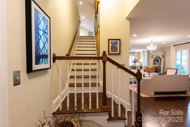 a view of staircase with lots of furniture and windows