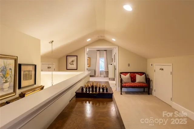 a spacious bedroom with a bed and a large window