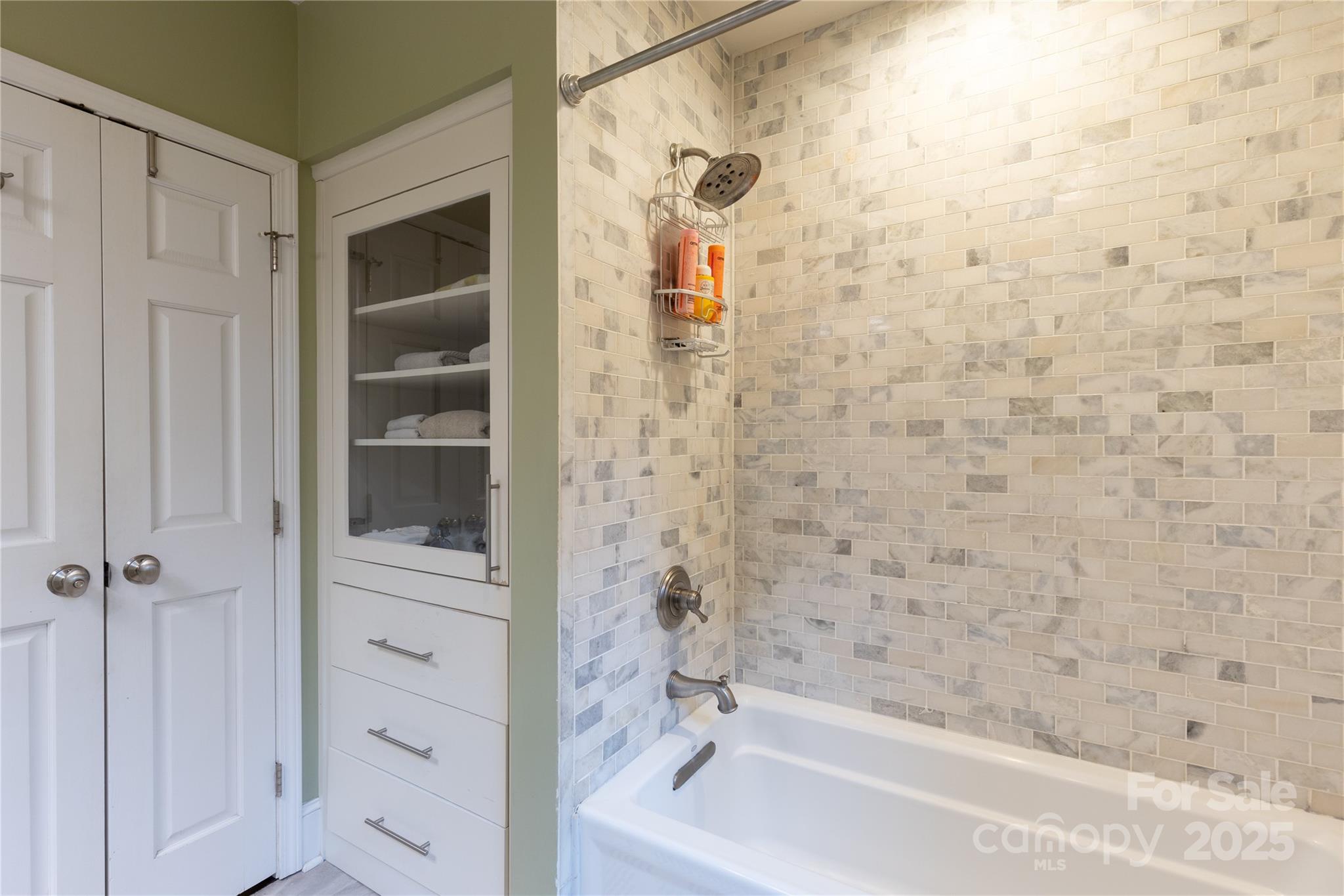 802 East Franklin Street Monroe, NC 28112 - Photo 7 of 48 a bathroom with a bathtub and shower