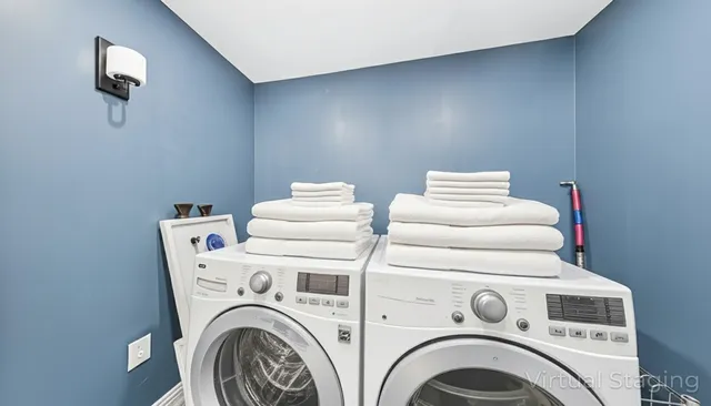 a front view of a house with swimming pool and sitting area