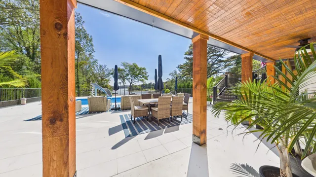 a view of a lake with houses in the back