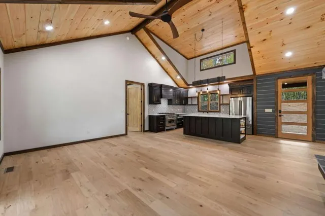 a view of kitchen and refrigerator in a kitchen