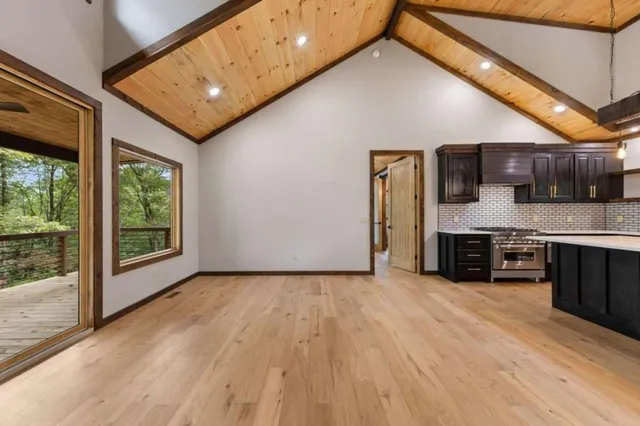 a view of a kitchen with a sink and a window