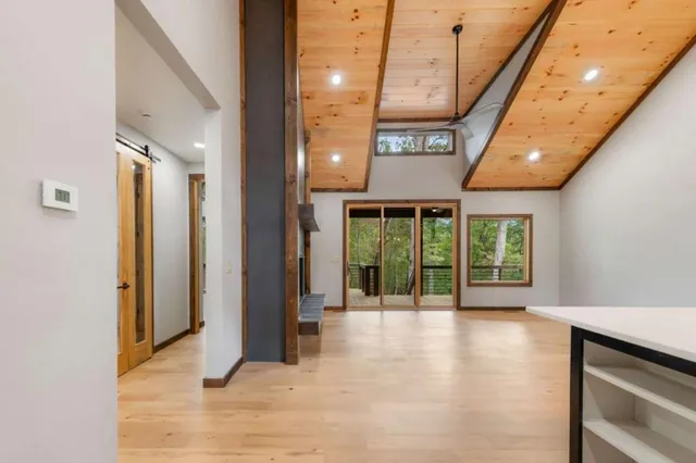 a view of an entryway with a floor to ceiling window