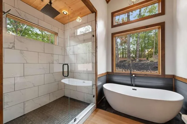 a white bath tub sitting next to a window