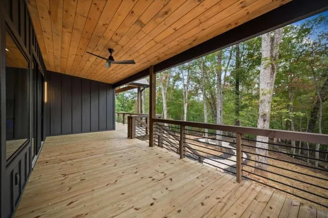a view of a balcony with wooden floor