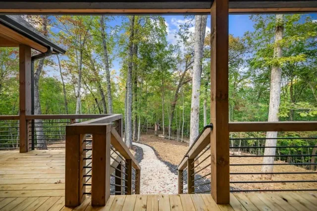 a view of a deck with wooden floor and wooden fence