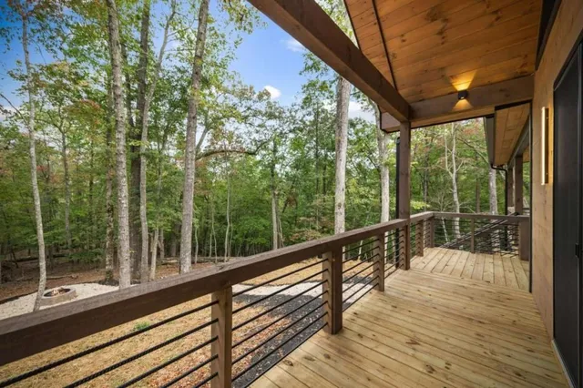 a view of two chairs in a balcony