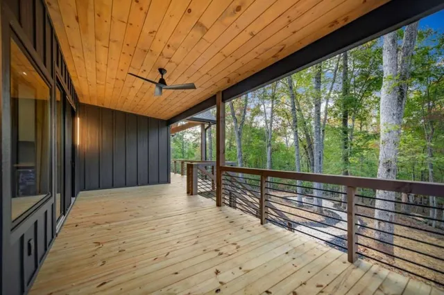 a view of a balcony with wooden floor