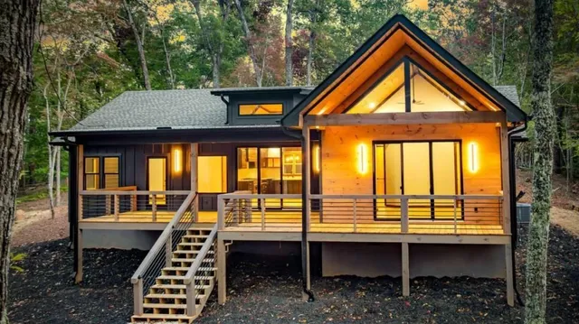 a front view of a house with outdoor seating