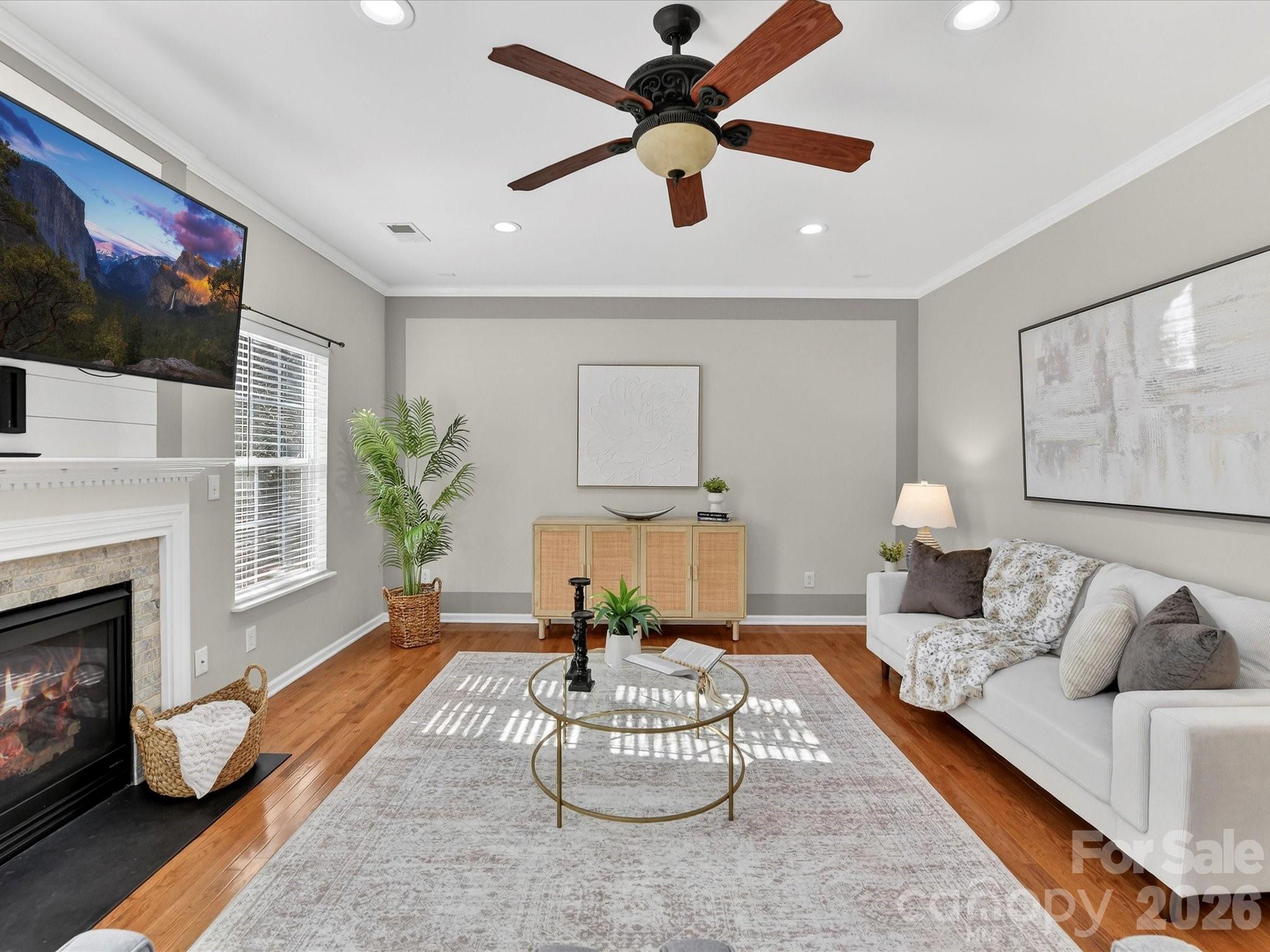 119 Edgington Street Mooresville, NC 28115 - Photo 13 of 43 a living room with furniture and a fireplace